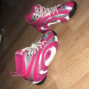 Pink, white, grey, and black  Reebok shaqnosis